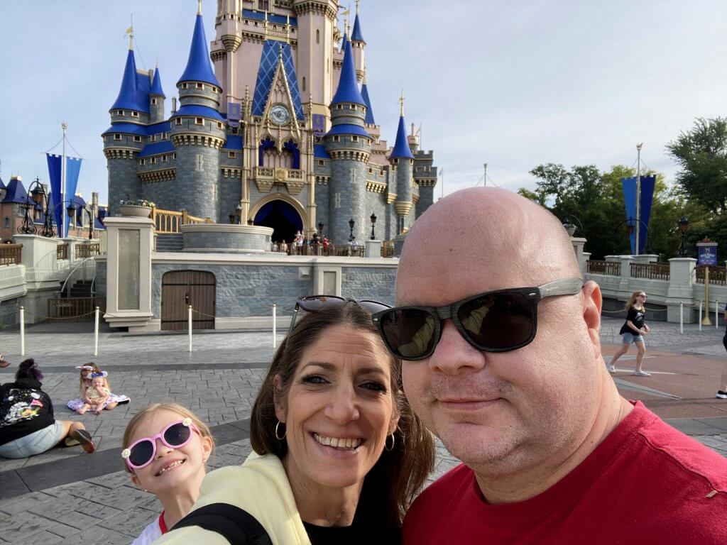 Shawn and his family in front of Cinderella Castle