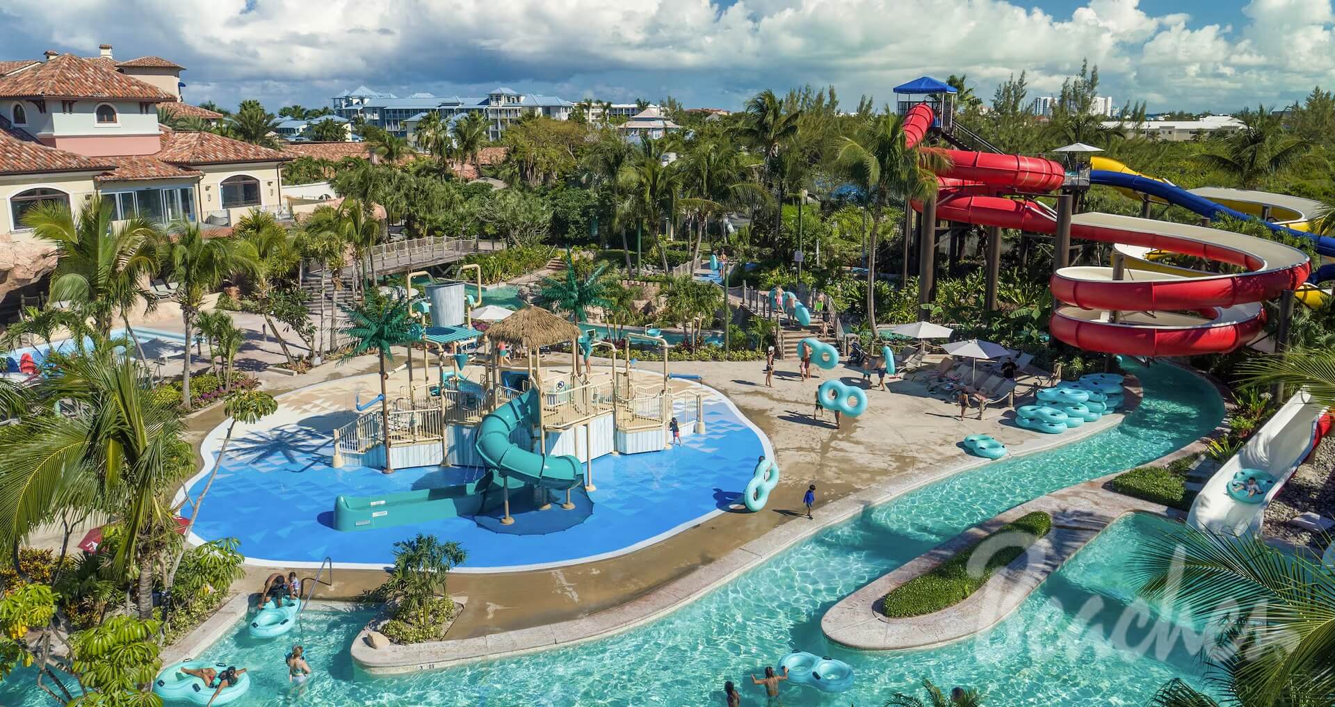 Resort waterpark with waterslides, a lazy river, and a kids splash area at a Beaches resort